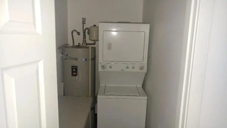 Stackable washer and dryer with water heater.